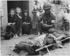 private_roy_w-_humphrey_of_toledo_ohio_is_being_given_blood_plasma_after_he_was_wounded_by_shrapnel_in_sicily_on_8-9-43_-_nara_-_197268